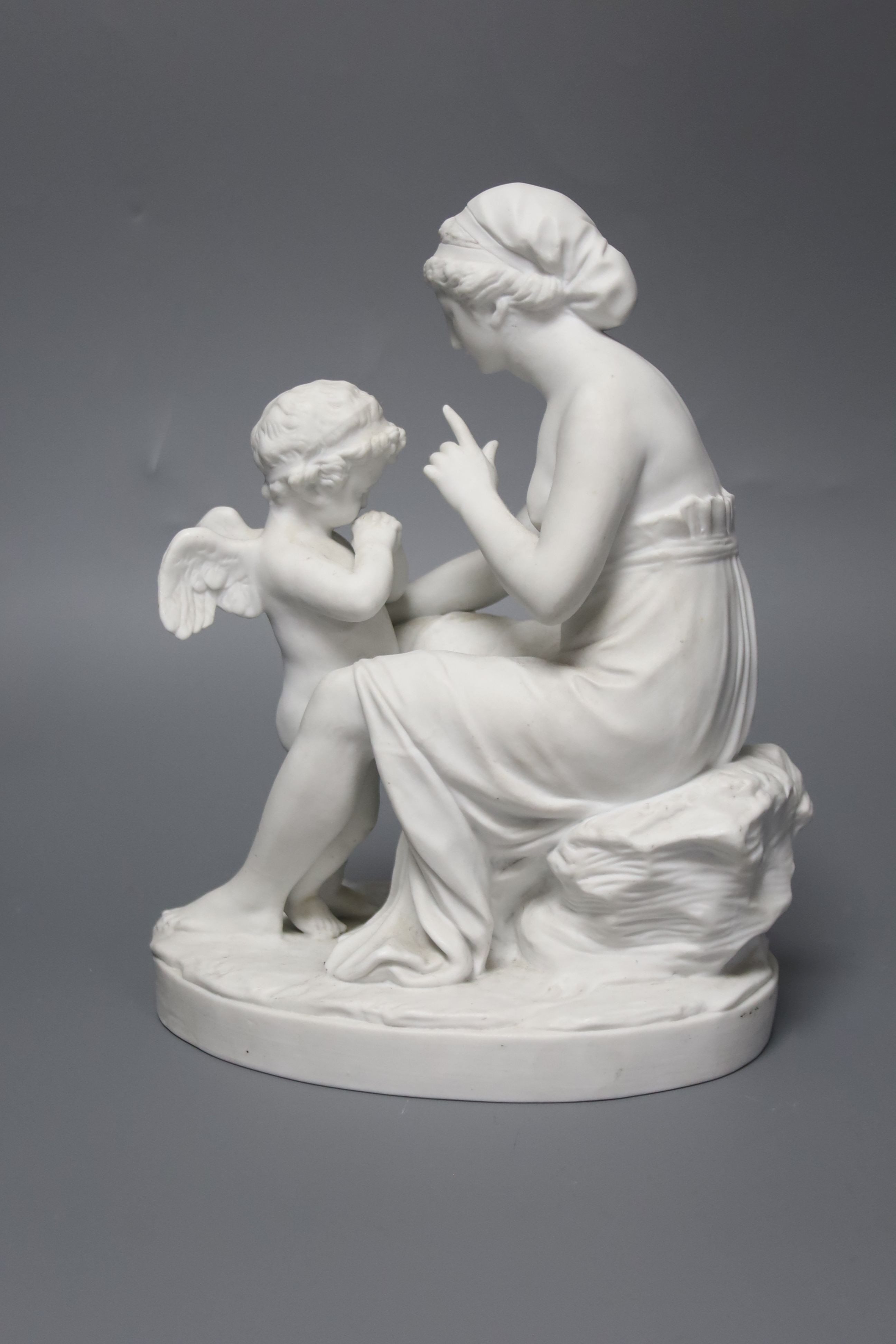 A Sevres biscuit porcelain group, ‘La Lecon a L’ Amour ’, 21cm high.